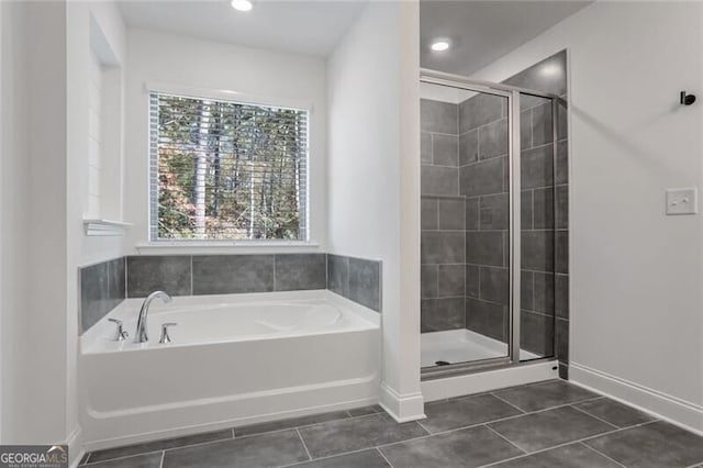 bathroom with plus walk in shower and tile patterned flooring