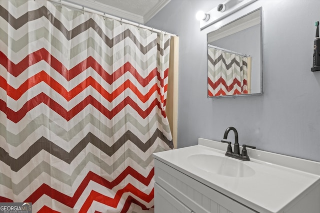 bathroom with vanity, a shower with shower curtain, and ornamental molding