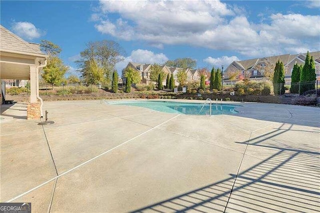 view of swimming pool with a patio