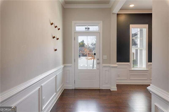 entryway featuring dark hardwood / wood-style flooring and crown molding