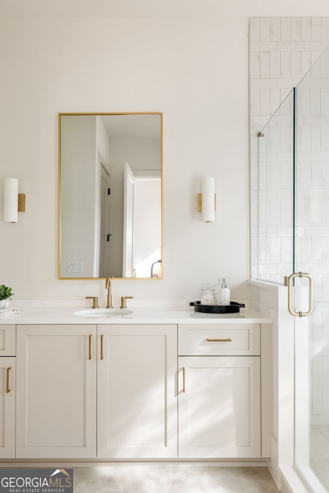 bathroom featuring vanity and a shower with door