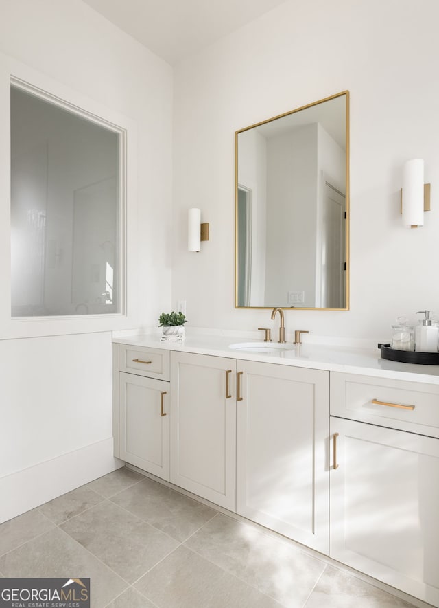 bathroom with vanity and tile patterned floors