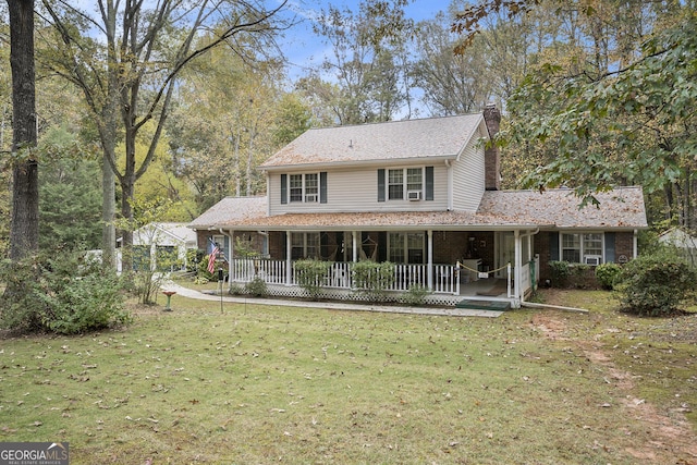 view of front facade featuring a porch and a front yard