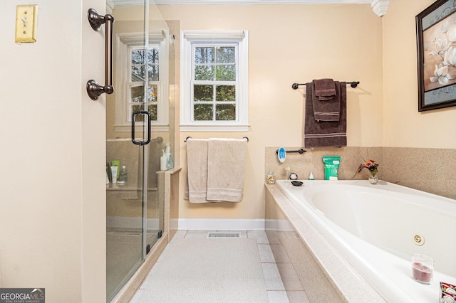 bathroom featuring tile patterned floors and plus walk in shower