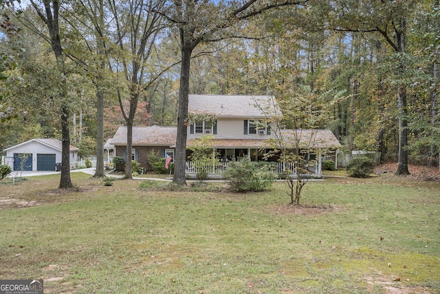 view of front facade with a front yard and covered porch