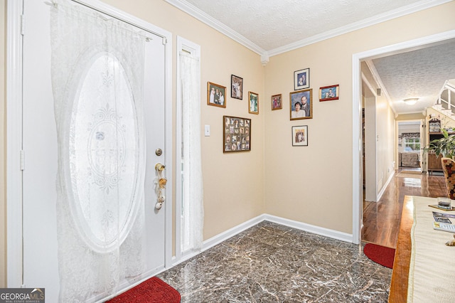 foyer featuring ornamental molding and a textured ceiling