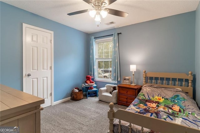 bedroom featuring light colored carpet and ceiling fan