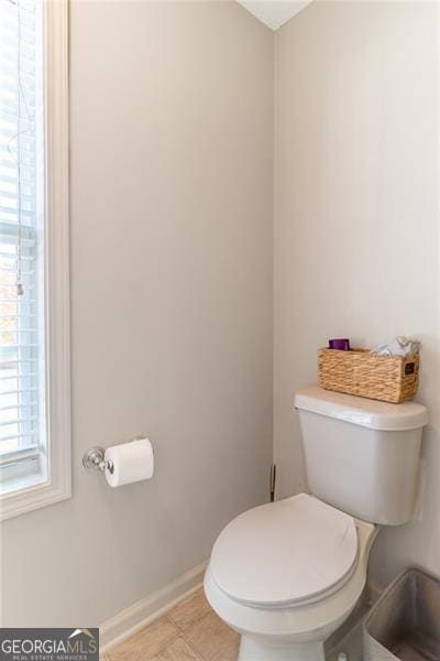 bathroom featuring tile patterned flooring and toilet