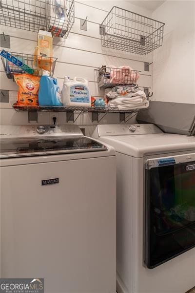 washroom featuring washing machine and dryer