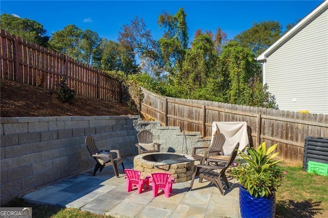 view of patio / terrace with a fire pit