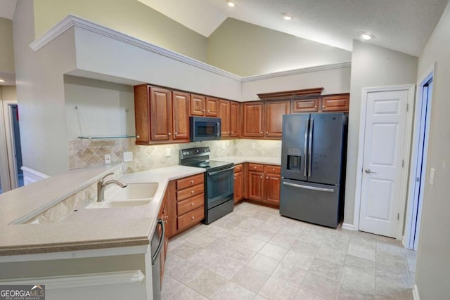 kitchen with sink, light tile patterned floors, black appliances, a textured ceiling, and kitchen peninsula