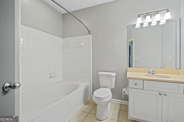 full bathroom featuring tile patterned flooring, vanity, toilet, and tiled shower / bath