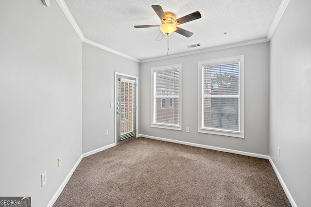 empty room with carpet flooring, ceiling fan, crown molding, and a textured ceiling