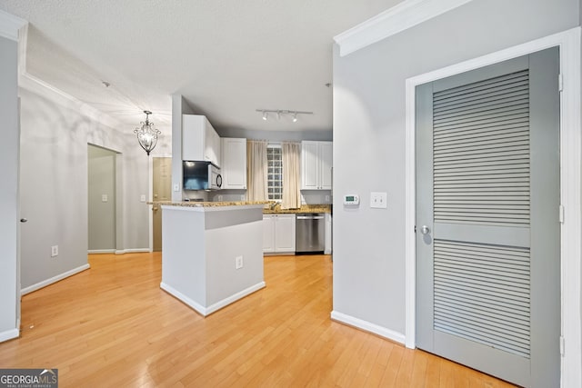 kitchen featuring white cabinets, light hardwood / wood-style floors, a textured ceiling, and appliances with stainless steel finishes