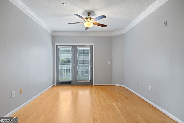 spare room with crown molding, ceiling fan, light hardwood / wood-style floors, and a textured ceiling