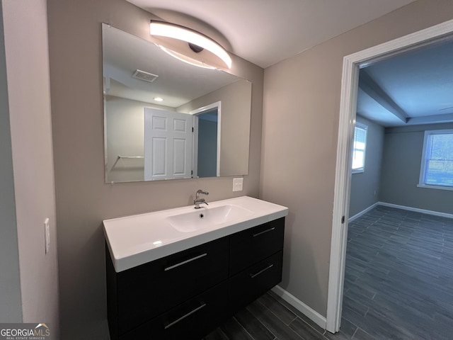 bathroom featuring hardwood / wood-style floors and vanity