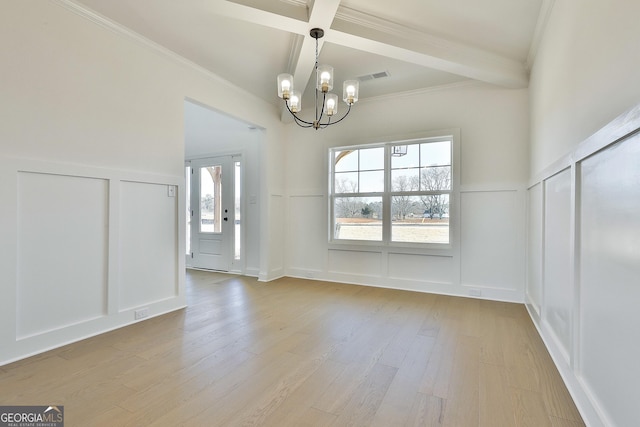 unfurnished dining area featuring beamed ceiling, light hardwood / wood-style floors, coffered ceiling, and an inviting chandelier