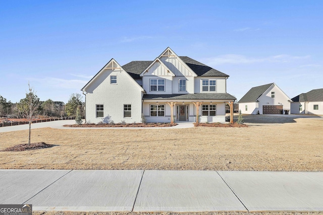 view of front of property with a porch and a garage