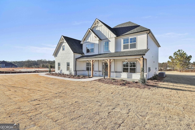 view of front of home with covered porch and central air condition unit