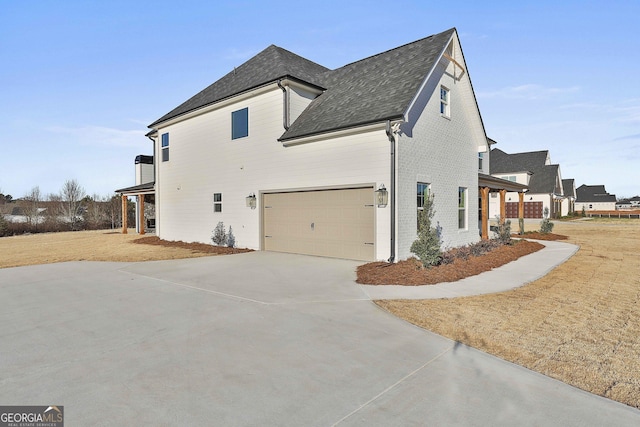 view of side of property with a garage