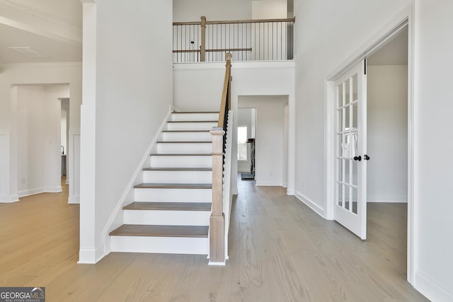 stairs featuring hardwood / wood-style flooring