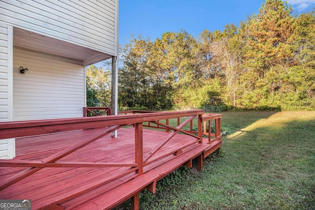 wooden deck with a lawn