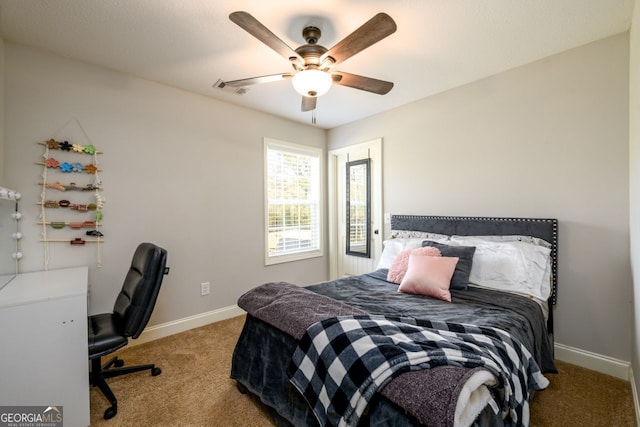 bedroom with ceiling fan and light carpet