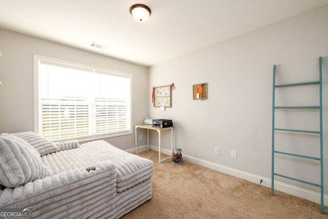 bedroom featuring light colored carpet