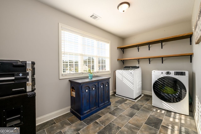 washroom featuring washing machine and dryer