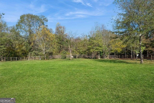 view of yard with a rural view