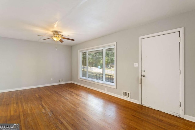 entrance foyer with ceiling fan and wood-type flooring