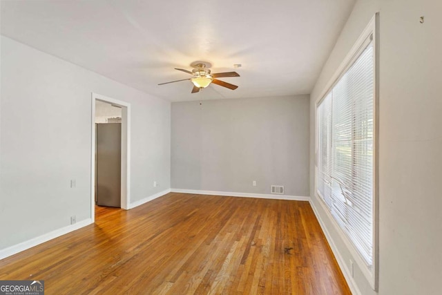 spare room featuring ceiling fan and wood-type flooring