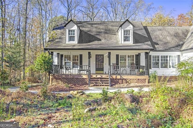 new england style home with a porch