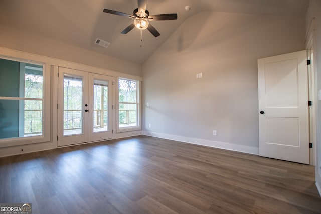 spare room with high vaulted ceiling, ceiling fan, dark hardwood / wood-style flooring, and french doors