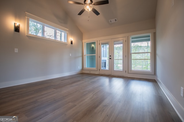 unfurnished room with a wealth of natural light, french doors, ceiling fan, and dark hardwood / wood-style floors