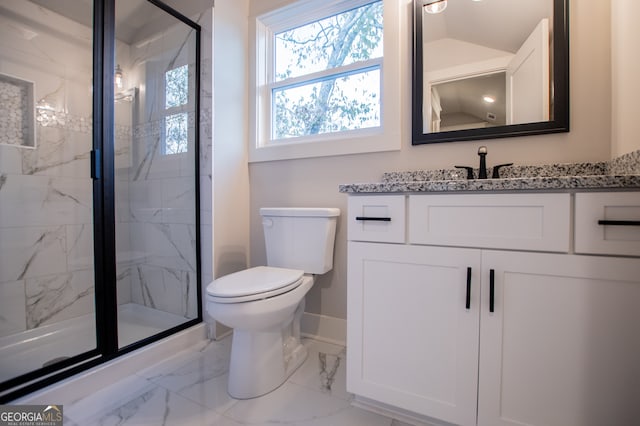 bathroom with a shower with door, vanity, and toilet