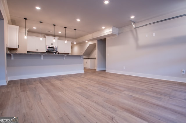 interior space with light hardwood / wood-style flooring and sink