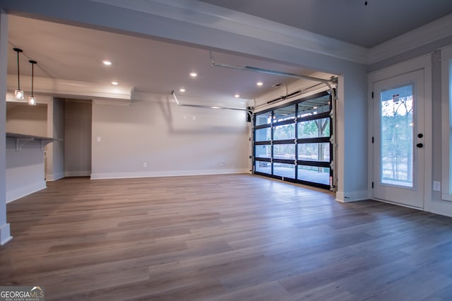 interior space featuring hardwood / wood-style flooring and crown molding