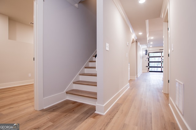 corridor featuring light hardwood / wood-style floors