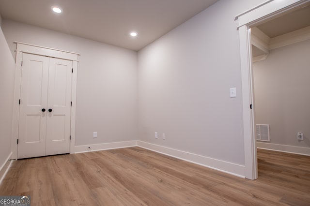 spare room featuring light wood-type flooring