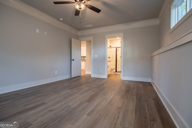 unfurnished bedroom with ensuite bath, ornamental molding, ceiling fan, and hardwood / wood-style flooring