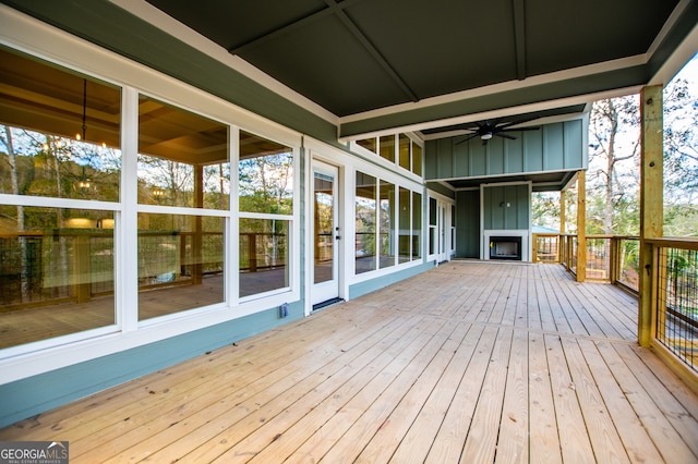 wooden terrace featuring ceiling fan