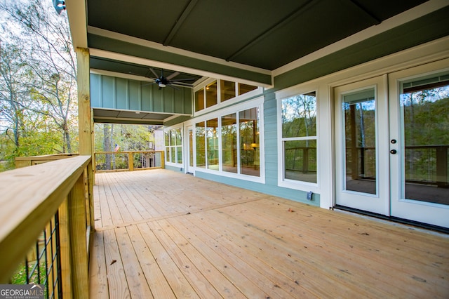 wooden terrace featuring ceiling fan and french doors