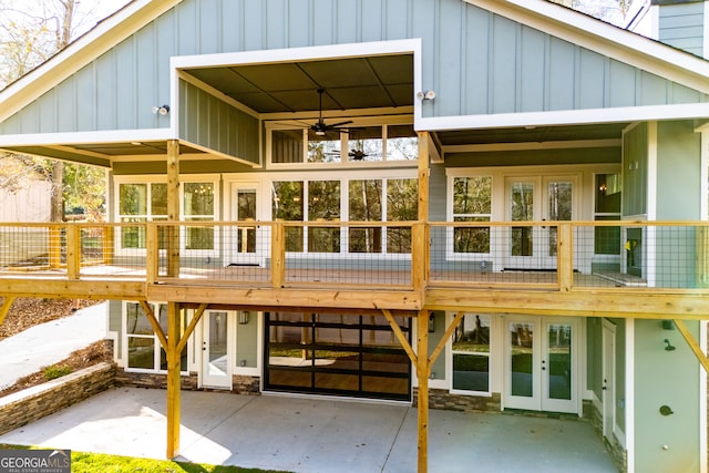 rear view of property featuring ceiling fan, a deck, and french doors