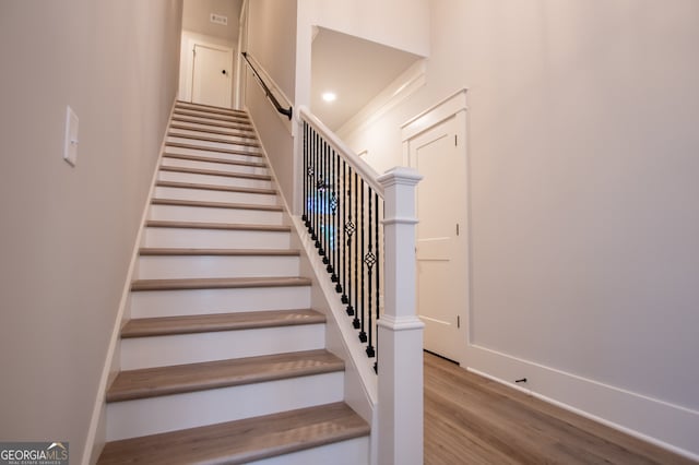 stairway with wood-type flooring