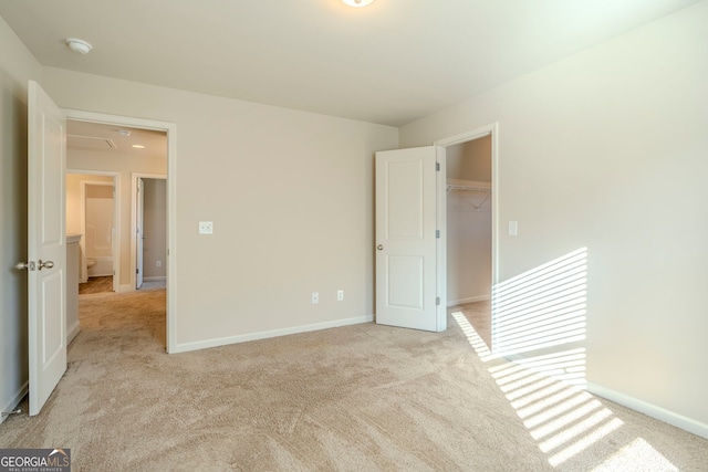 unfurnished room featuring light colored carpet