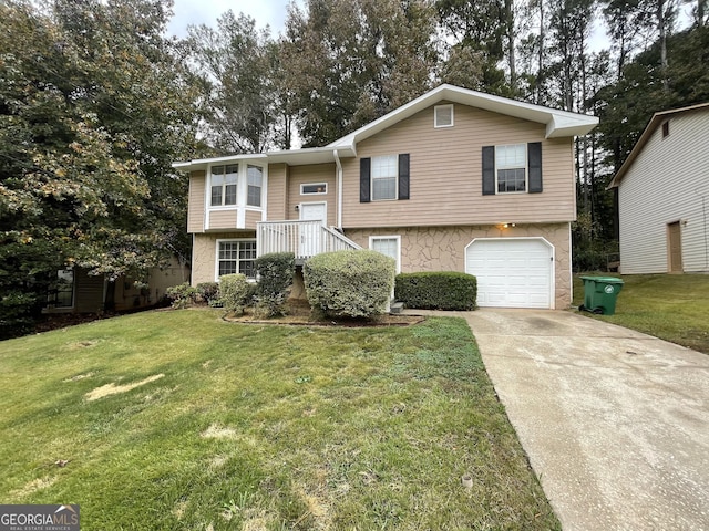 split foyer home with a front lawn and a garage