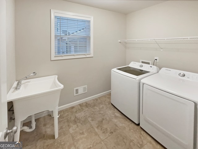 clothes washing area featuring washing machine and dryer