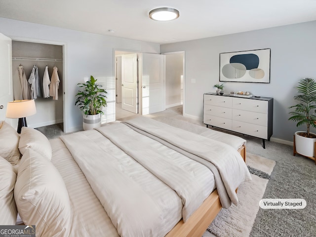 bedroom featuring a closet and light colored carpet