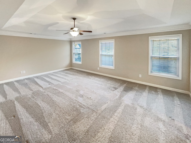 spare room with ornamental molding, ceiling fan, and plenty of natural light